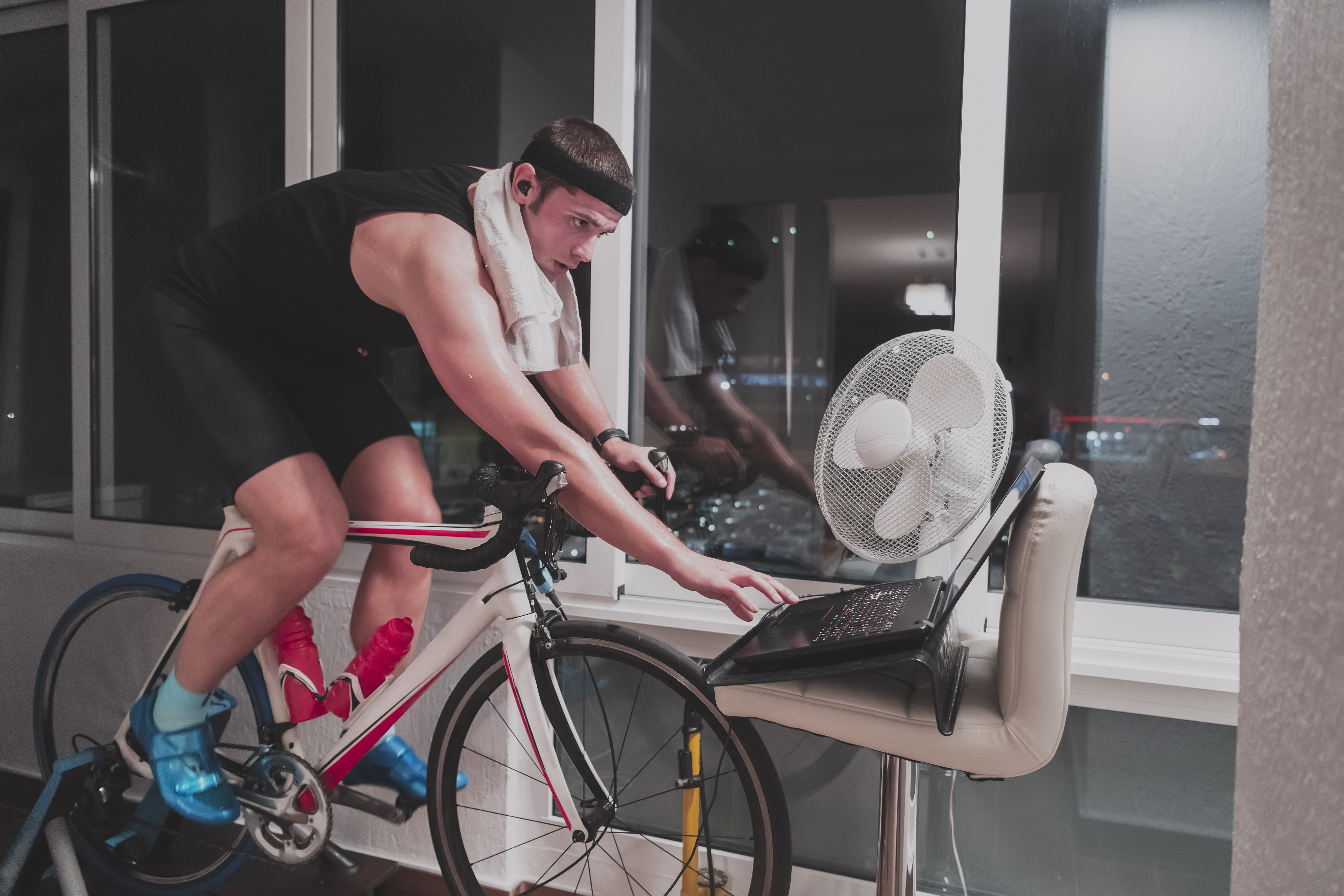 Cyclist setting up a smart trainer